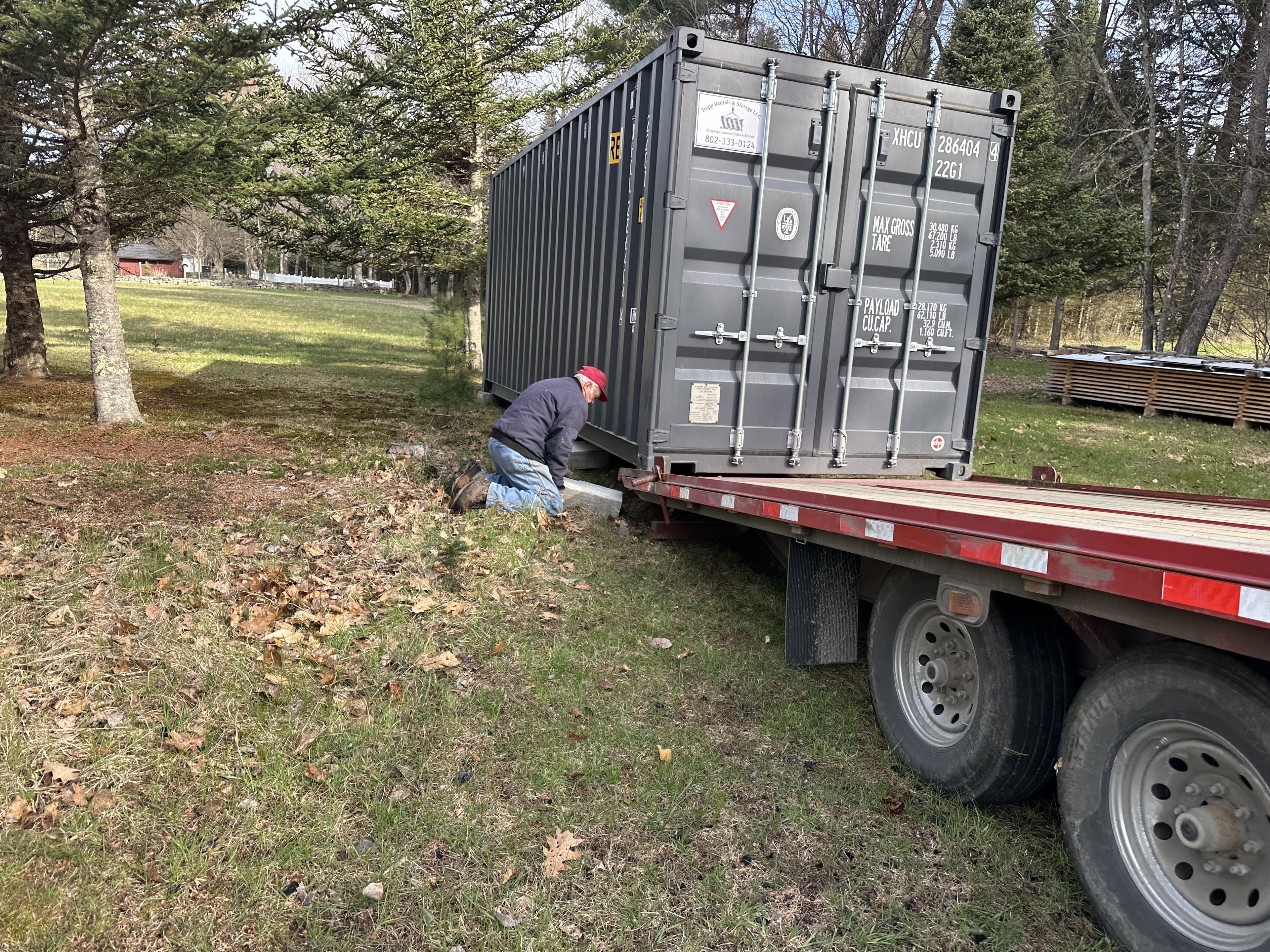 A Trapp Rentals and Storage container being set in place on a customer's property